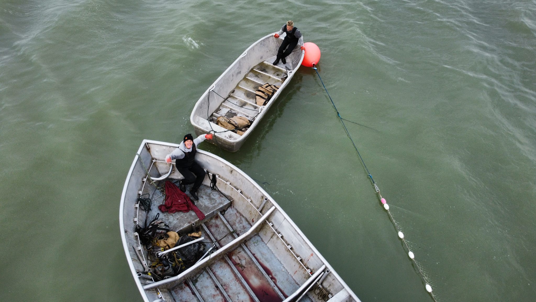 Aerial view of two fishing boats working set-nets